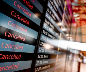 epaselect epa10519572 An electronic board shows canceled flights at the Berlin-Brandenburg airport, Germany, 13 March 2023. The employees of aviation security and ground handling services called for a 24 hours strike over wages.  EPA/FILIP SINGER