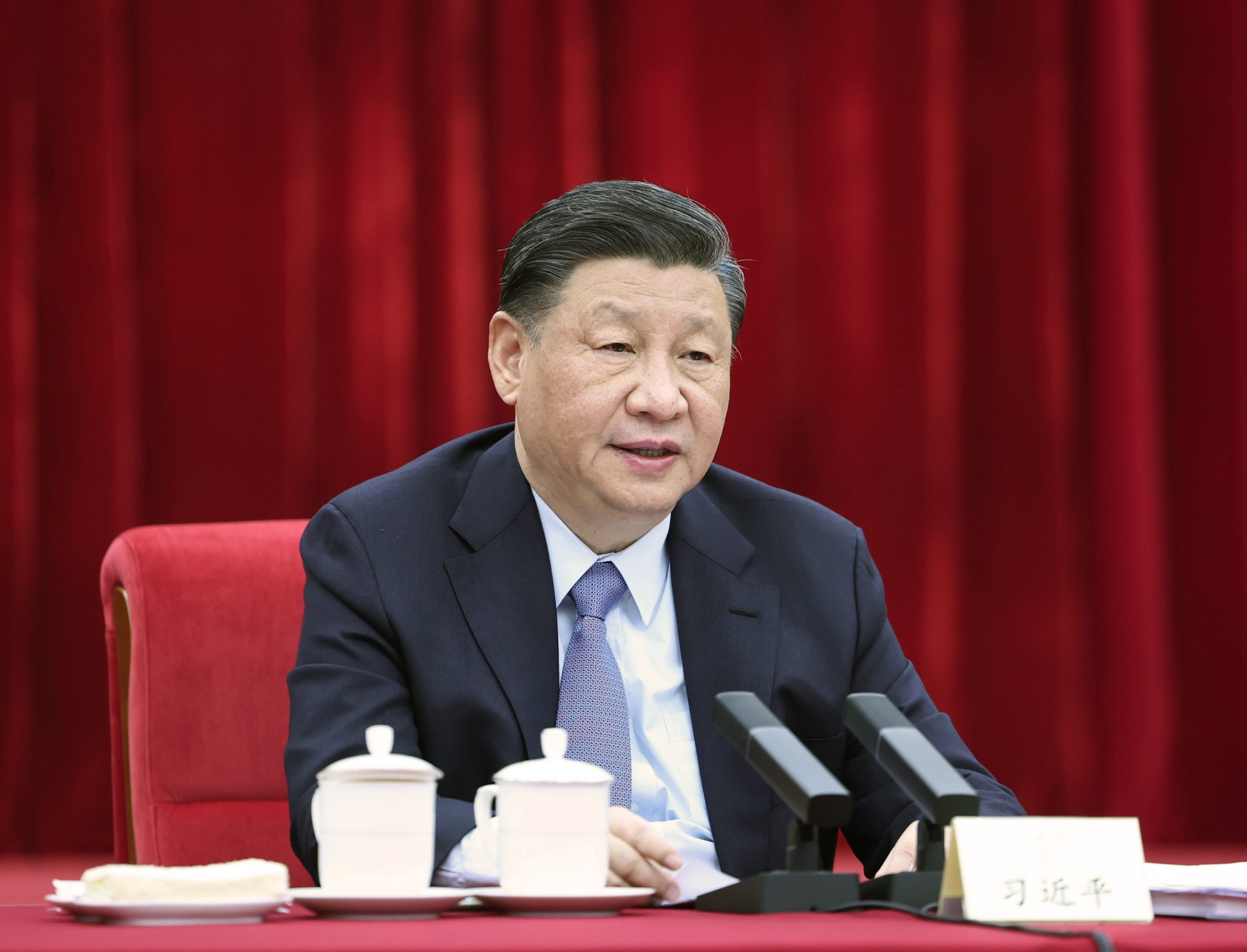 epa10506434 Xi Jinping, China's President, General Secretary of the Communist Party of China Central Committee and Chairman of the Central Military Commission, looks on while listening to the national political advisors from the China National Democratic Construction Association and the All-China Federation of Industry and Commerce, who are attending the first session of the 14th National Committee of the Chinese People's Political Consultative Conference (CPPCC), in Beijing, China, 06 March 2023. President Xi participated in their joint group meeting, and listened to their comments and suggestions.  EPA/XINHUA / Ju Peng CHINA OUT / MANDATORY CREDIT  EDITORIAL USE ONLY