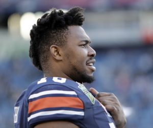 Auburn offensive lineman Prince Tega Wanogho watches from the sideline in the second half of the Music City Bowl NCAA college football game against Purdue Friday, Dec. 28, 2018, in Nashville, Tenn. Auburn won 63-14. (AP Photo/Mark Humphrey)
