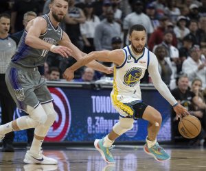 Sacramento Kings forward Domantas Sabonis (10) chases Golden State Warriors guard Stephen Curry (30) during the second half of Game 5 of an NBA basketball first-round playoff series Wednesday, April 26, 2023, in Sacramento, Calif. The Warriors won 123-116. (AP Photo/José Luis Villegas)