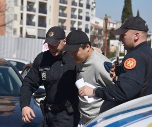 epa10540911 Police officers escort South Korean crypto mogul Do Kwon (C) in Podgorica, Montenegro, 24 March 2023. Do Kwon is wanted in South Korea, Singapore and the USA for the involvement in the collapse of his company Terraform, which is estimated to have cost investors more than 40 billion US dollars.  EPA/BORIS PEJOVIC