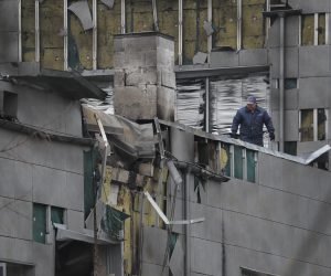 epa10546737 Workers clean debris at the site of a downed attack drone, in a residential area of Kyiv, Ukraine, 28 March 2023. According to the Air Force Command of the Armed Forces of Ukraine, air defence systems destroyed "all Russian targets" including Shahed attack drones over night. No casualties were recorded.  EPA/SERGEY DOLZHENKO