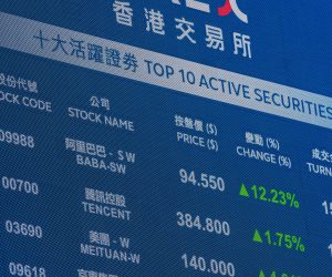 epa10548448 Alibaba Group shares price is displayed on a screen outside Exchange Square, the building housing the stock market, in Hong Kong, China, 29 March 2023. The Hang Seng Index jumped 2.1 per cent to 20,192.40 as Alibaba Group Holding rallied in Chinese technology companies after the company unveiled a business reorganisation to boost profits and add value to shareholders.  EPA/JEROME FAVRE