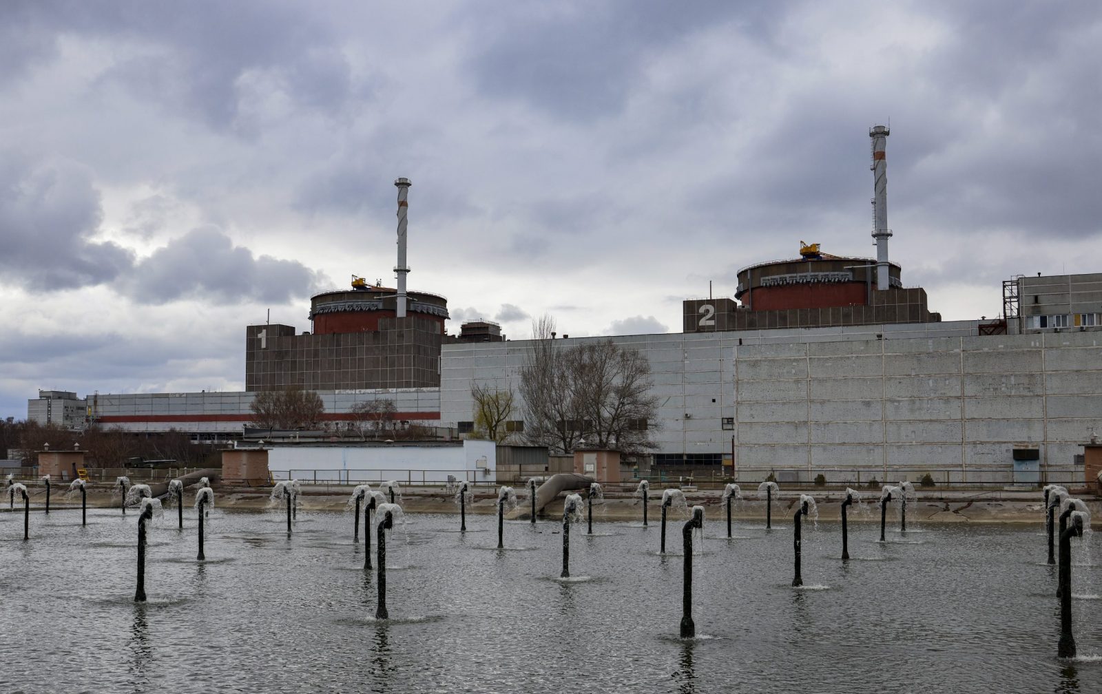 epa10549035 A picture taken during a visit by International Atomic Energy Agency (IAEA) Director-General Rafael Mariano Grossi to Enerhodar organised by the Russian military shows a general view of Zaporizhzhia Nuclear Power Plant in Enerhodar, southeastern Ukraine, 29 March 2023. According to Ukrainian national nuclear energy company Energoatom, 'Grossi plans to see how the situation at the ZNPP has changed, talk to the staff working there, and act as a guarantor of the rotation of members of the IAEA’s permanent mission, which has been at the ZNPP since September 2022.'  EPA/SERGEI ILNITSKY