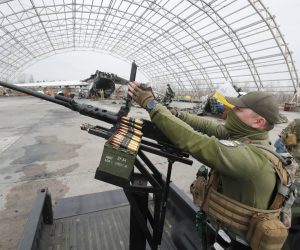 epa10553623 A Ukrainian serviceman handles a machine gun during the handing over of ten pick-up trucks to mobile anti-drone units near the largest Ukrainian cargo aircraft Antonov An-225 Mriya 'Dream' that was destroyed during the Russian attacks on Hostomel Airfield not far from Kyiv, Ukraine, 01 April 2023 amid the Russian invasion. Mobile anti-drone units have the task to track and destroy enemy kamikaze drones and other low-flying aerial targets. Russian troops on 24 February 2022, entered Ukrainian territory, starting a conflict that has provoked destruction and a humanitarian crisis.  EPA/SERGEY DOLZHENKO