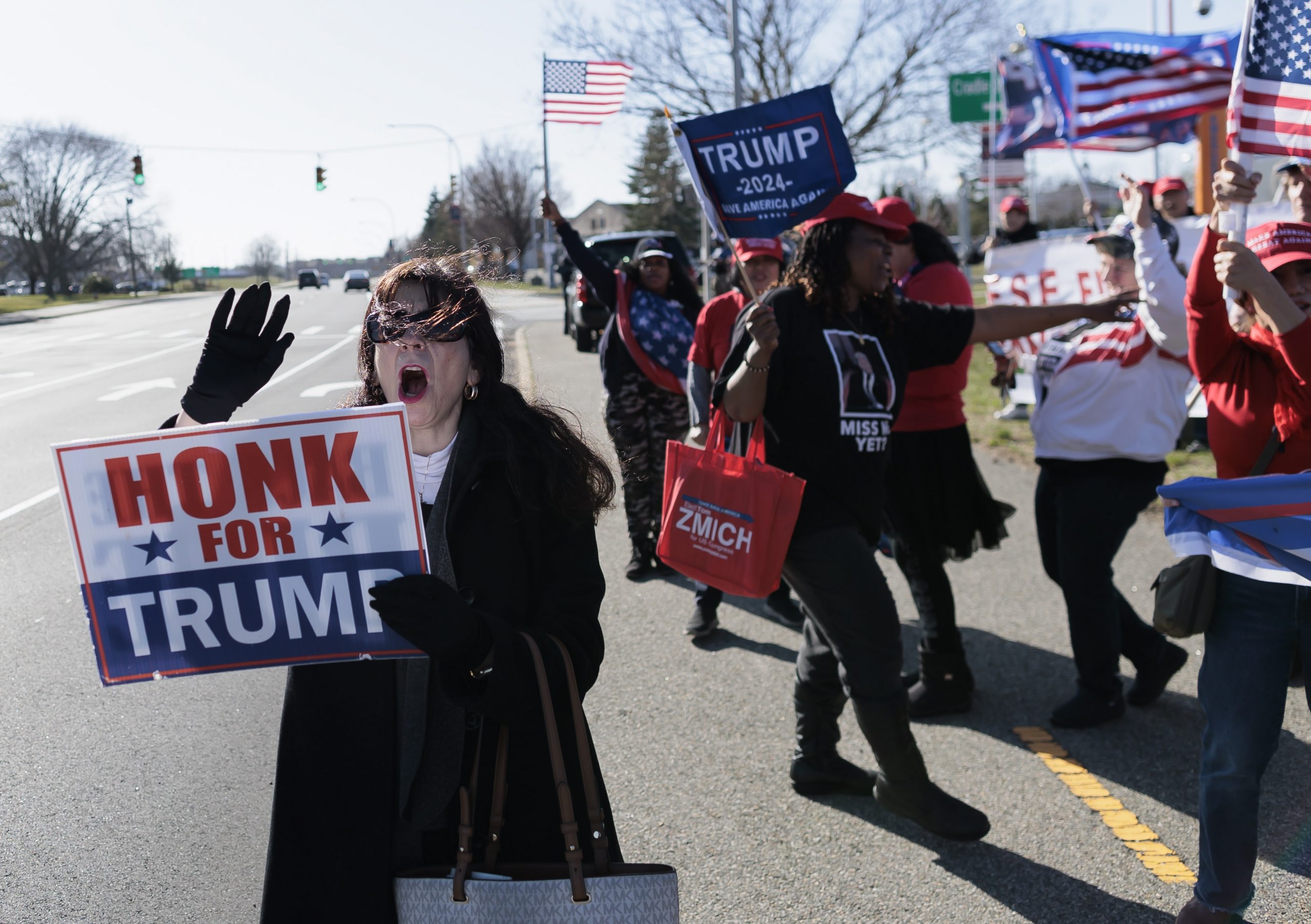 epa10554641 Supporters of former President Donald J. Trump gather for a rally of support outside of an event with Florida Governor Ron DeSantis in Garden City, New York, USA, 01 April 2023. Trump is reportedly set to appear in court on Tuesday after a Manhattan grand jury indicted him last week.  EPA/JUSTIN LANE