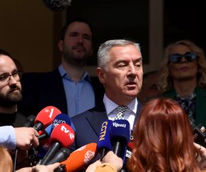 epa10555321 Presidential candidate and incumbent Montenegro's President Milo Djukanovic talks to media after casting his ballot during the second round of the Presidential elections in Podgorica, Montenegro, 02 April 2023. Some 540,000 eligible voters are casting their ballots to chose the next President of Montenegro.  EPA/BORIS PEJOVIC