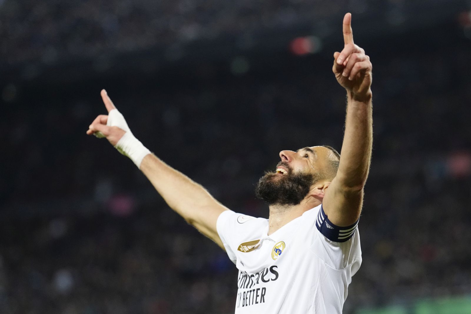epa10560633 Real Madrid's striker Karim Benzema celebrates after scoring the 0-4 goal during the Spanish King's Cup semifinal second leg soccer match between FC Barcelona and Real Madrid, in Barcelona, Spain, 05 April 2023.  EPA/Enric Fontcuberta