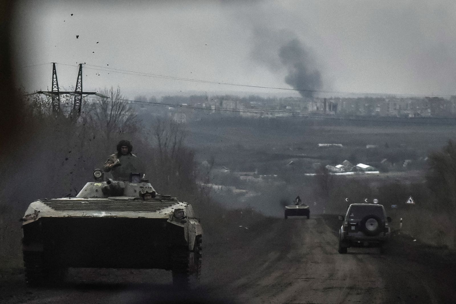 epa10562813 Armoured personnel carriers (APC) drive along the road from Bakhmut as heavy fighting for the control of the town continues, Donetsk region, eastern Ukraine, 06 April 2023 (issued 07 April 2023). Russian troops entered Ukrainian territory on 24 February 2022, starting a conflict that has provoked destruction and a humanitarian crisis.  EPA/OLEG PETRASYUK