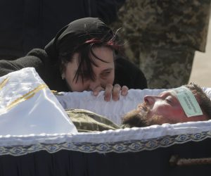 epa10568296 Relatives, friends, and comrades attend during the funeral ceremony for Ukrainian serviceman Kostyantyn Starovytsky in Brovary near Kyiv, Ukraine, 11 April 2023. Kyiv Opera director and conductor Kostyantyn Starovytsky was killed in action while fighting against Russian troops near Kramatorsk.  EPA/SERGEY DOLZHENKO