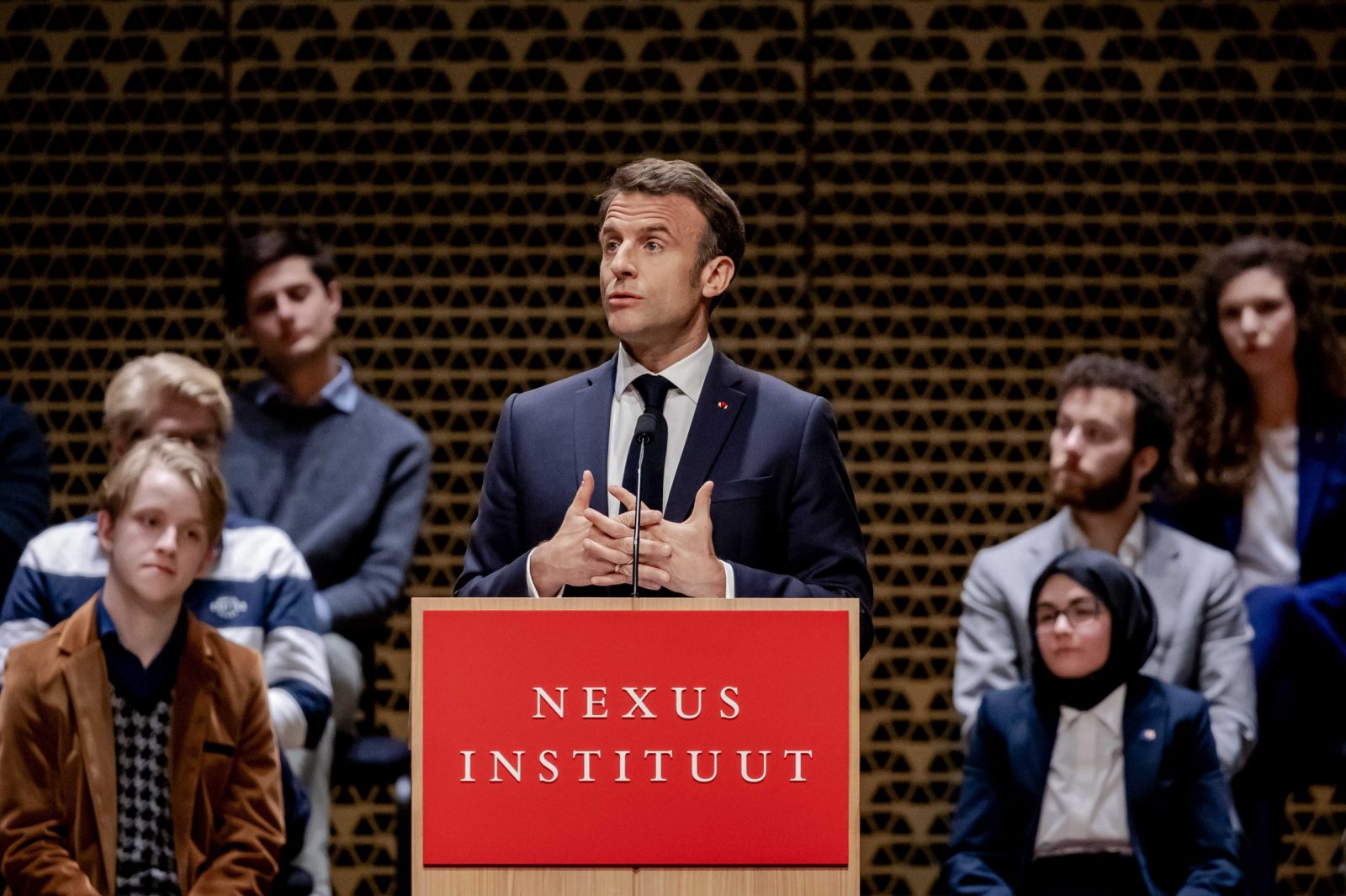 epa10568516 French President Emmanuel Macron delivers a speech in The Hague, Netherlands, 11 April 2023. The French president and his wife are paying a two-day state visit to the Netherlands.  EPA/REMKO DE WAAL
