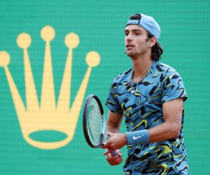 epa10570979 Lorenzo Musetti of Italy in action during his third round match against Novak Djokovic of Serbia at the Monte-Carlo Rolex Masters tournament in Roquebrune Cap Martin, France, 13 April 2023.  EPA/SEBASTIEN NOGIER