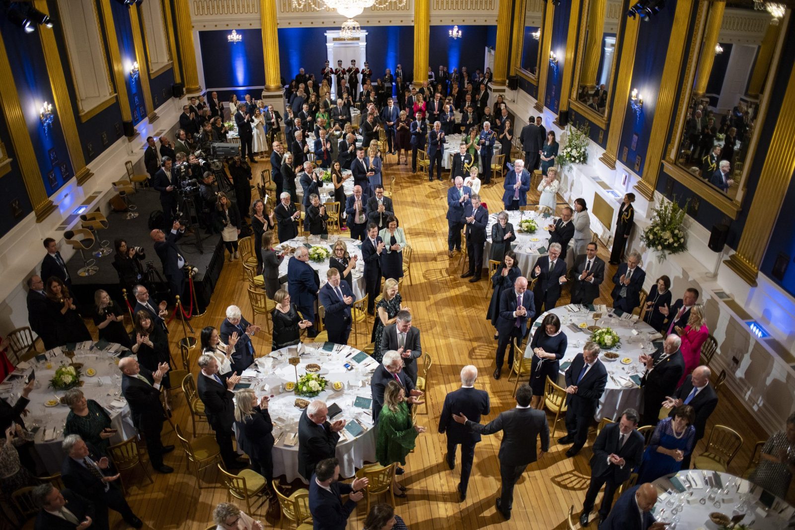 epa10571637 US President Joe Biden and Irish Taoiseach Leo Varadkar enter the ballroom at Dublin Castle at the official banquet dinner in Dublin, Ireland, 13 April 2023. This is the second day of a four-day visit by President Biden to Northern Ireland and the Republic of Ireland to mark the 25th anniversary of the Good Friday Agreement.  EPA/TOLGA AKMEN / POOL