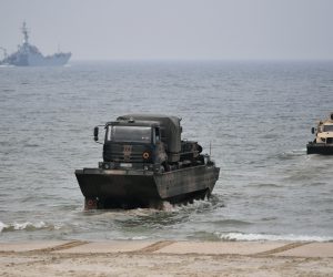 epa10576973 Amphibious vehicles land on a beach section in tactical exercises of the 16th Mechanized Division along with allied troops under the codename 'Zalew-23', in Skowronki near the Vistula Spit canal, northern Poland, 17 April 2023. Following a break over the Easter holidays some 2,500 soldiers from units of the Land Forces, the Navy, Territorial Defense Forces and allied forces that are part of the NATO Battalion Battle Group and the Engineering Forces, continued to take part in the military exercise aimed at responding to threats of military and non-military nature from the sea, using the new waterway through the Vistula Spit, in the border area on the Vistula Lagoon, according to the Polish Armed Forces.  EPA/Adam Warzawa POLAND OUT