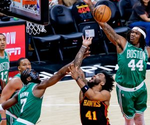 epa10584798 Atlanta Hawks forward Saddiq Bey (C) in action against Boston Celtics center Robert Williams III (R) and Boston Celtics guard Jaylen Brown (L) during the first half of game three of the NBA Eastern Conference first round series between the Boston Celtics and the Atlanta Hawks at State Farm Arena in Atlanta, Georgia, USA, 21 April 2023.  EPA/ERIK S. LESSER  SHUTTERSTOCK OUT