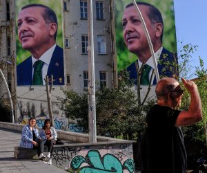 epa10589403 Young girls sit in front of the pictures of Turkish President Recep Tayyip Erdogan in Istanbul, Turkey, 24 April 2023. General elections will be held in Turkey on 14 June 2023 with a two-round voting to elect the President of Turkey and simultaneously parliamentary elections to elect the members the Grand National Assembly of Turkey.  EPA/SEDAT SUNA
