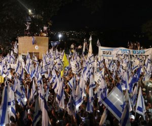 epa10594981 Israeli right-wing government supporters rally outside the Israeli Knesset in Jerusalem, in support of the government, 27 April 2023. The protesters called to implement the government's plans to reform the justice system and limit the power of the Israeli Supreme Court.  EPA/ATEF SAFADI