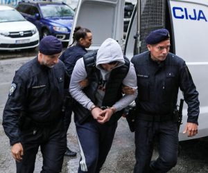 16.04.2023.,Slavonski Brod -  Privedeni mladic osumnjicen za ubojstvo vojnika u Pozegi izlazi u pratnji policije iz zgrade Zupanijskog drzavnog odvjetnistva u Slavonskom Brodu Photo: Dubravka Petric/PIXSELL