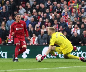 Soccer Football - Premier League - Liverpool v Arsenal - Anfield, Liverpool, Britain - April 9, 2023 Arsenal's Aaron Ramsdale saves a shot from Liverpool's Darwin Nunez REUTERS/Phil Noble EDITORIAL USE ONLY. No use with unauthorized audio, video, data, fixture lists, club/league logos or 'live' services. Online in-match use limited to 75 images, no video emulation. No use in betting, games or single club /league/player publications.  Please contact your account representative for further details. Photo: Phil Noble/REUTERS