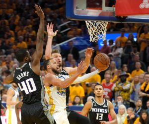 Apr 23, 2023; San Francisco, California, USA; Golden State Warriors guard Stephen Curry (center front) shoots against Sacramento Kings forward Harrison Barnes (40) and forward Domantas Sabonis (center back) during the fourth quarter of game four of the 2023 NBA playoffs at Chase Center. Mandatory Credit: Darren Yamashita-USA TODAY Sports Photo: Darren Yamashita/REUTERS