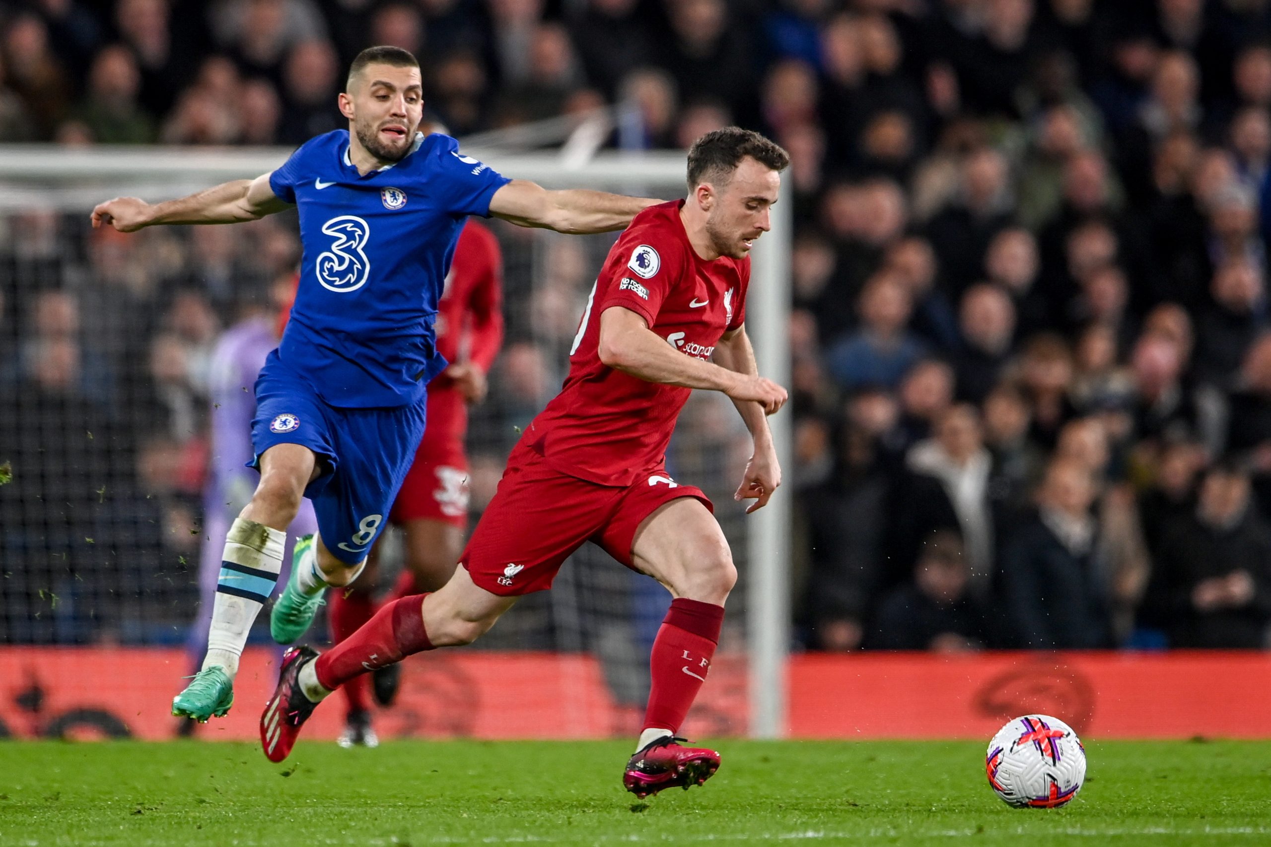 epa10558804 Mateo Kovacic of Chelsea (L) in action against Konstantinos Tsimikas of Liverpool (R) during the English Premier League soccer match between Chelsea FC and Liverpool FC in London, Britain, 04 April 2023.  EPA/ANDY RAIN EDITORIAL USE ONLY. No use with unauthorized audio, video, data, fixture lists, club/league logos or 'live' services. Online in-match use limited to 120 images, no video emulation. No use in betting, games or single club/league/player publications