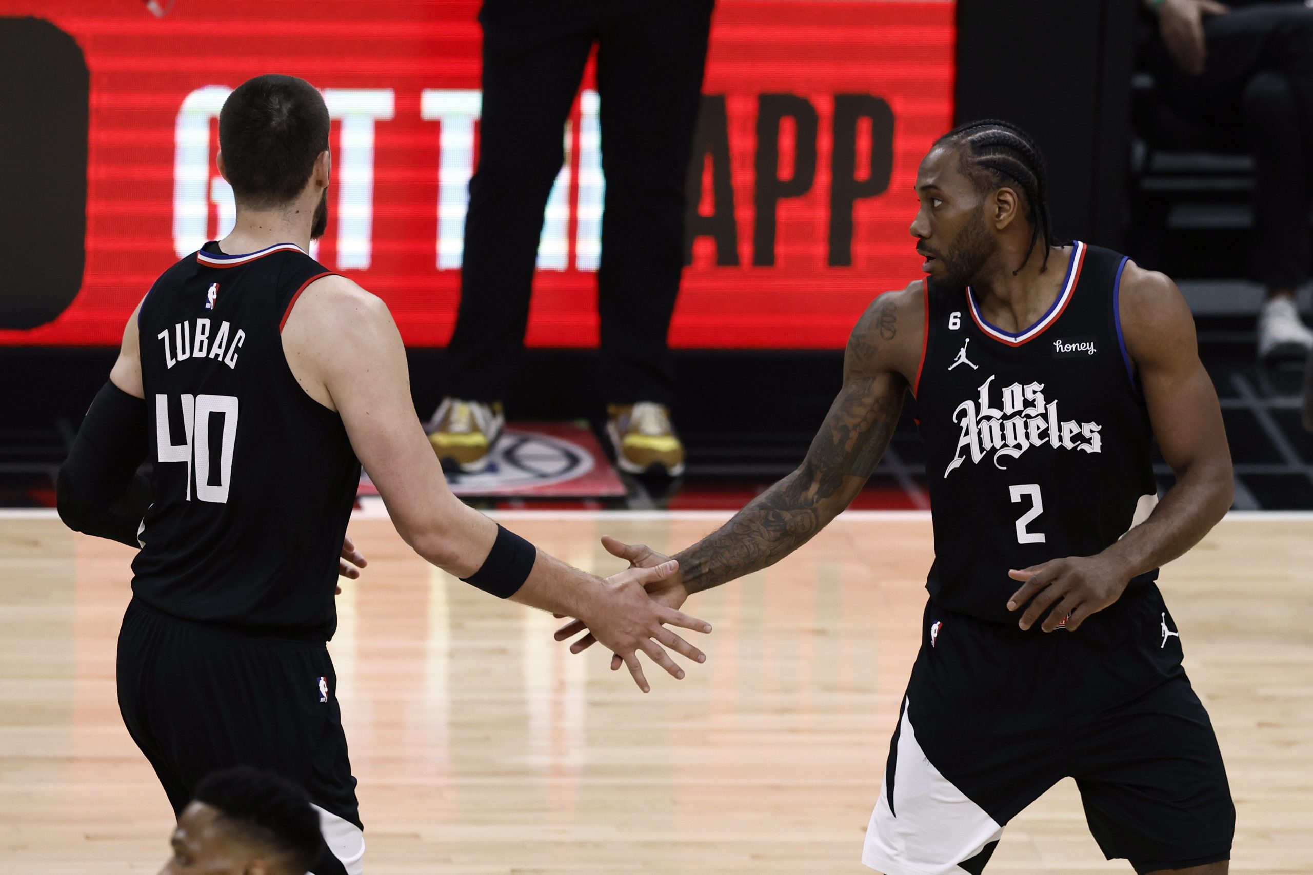 epa10560977 LA Clippers center Ivica Zubac (L) interacts with LA Clippers forward Kawhi Leonard after he scored during the first quarter of the game between the Los Angeles Clippers and the Los Angeles Lakers at Crypto.com Arena in Los Angeles, California, USA, 05 April 2023.  EPA/ETIENNE LAURENT SHUTTERSTOCK OUT