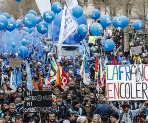 epa10547029 People participate in a protest against government pension reform in Paris, France, 28 March 2023. France faces an ongoing national strike against the government's pensions reform after Prime Minister Elisabeth Borne on 16 March announced the use of article 49 paragraph 3 (49.3) of the Constitution of France to have the text on the controversial pension reform law to be definitively adopted without a vote.  EPA/CHRISTOPHE PETIT TESSON
