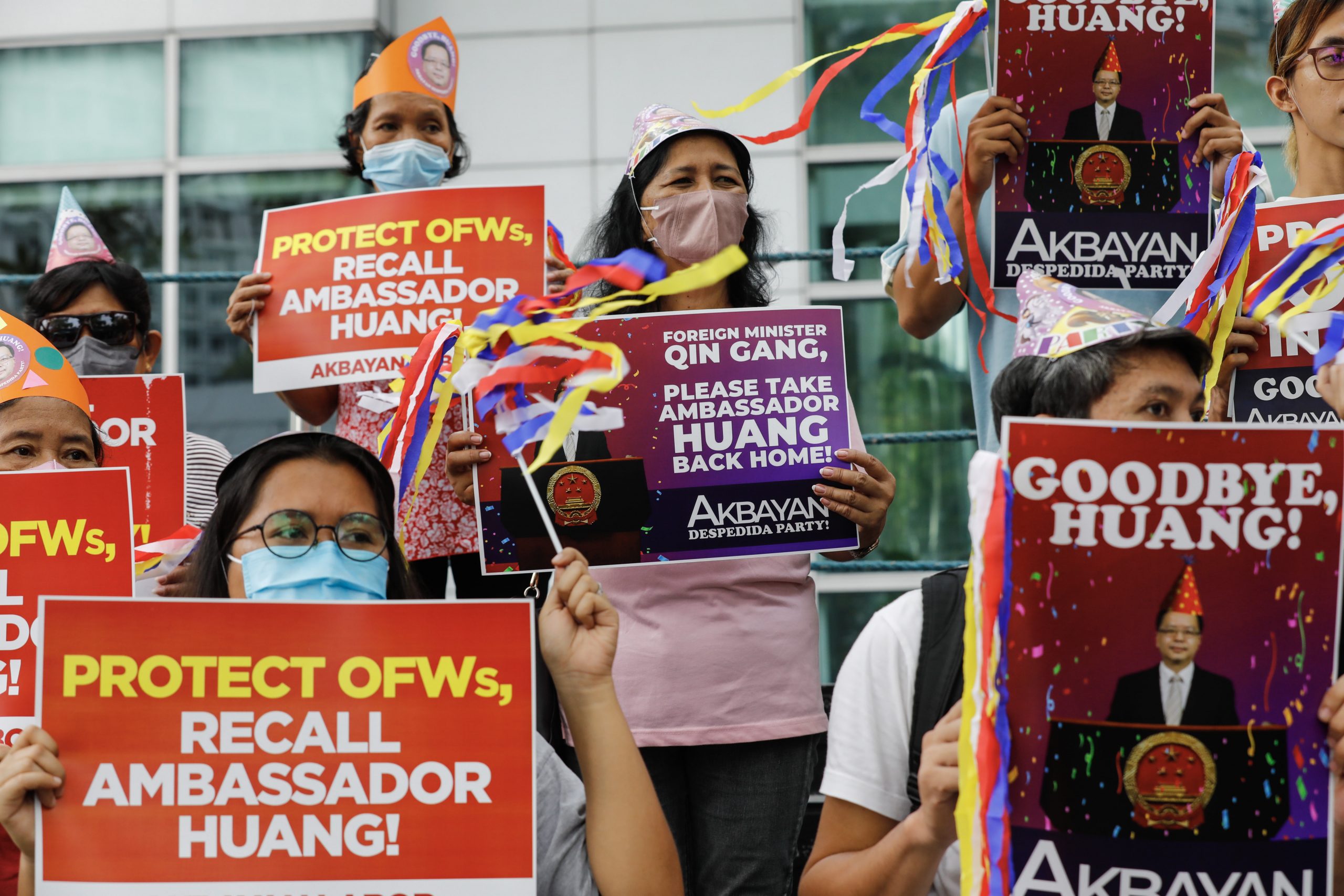 epa10583474 Protesters hold send-off party themed signs calling for the recall of Chinese Ambassador to the Philippines Huang Xilian, during a rally outside the Chinese Consulate in Makati City, Metro Manila, Philippines, 21 April 2023. Protesters asked visiting Chinese Foreign Minister Qin Gang to work on recalling Huang Xilian, following statements made by the ambassador advising the Philippines to oppose Taiwan independence.  EPA/ROLEX DELA PENA
