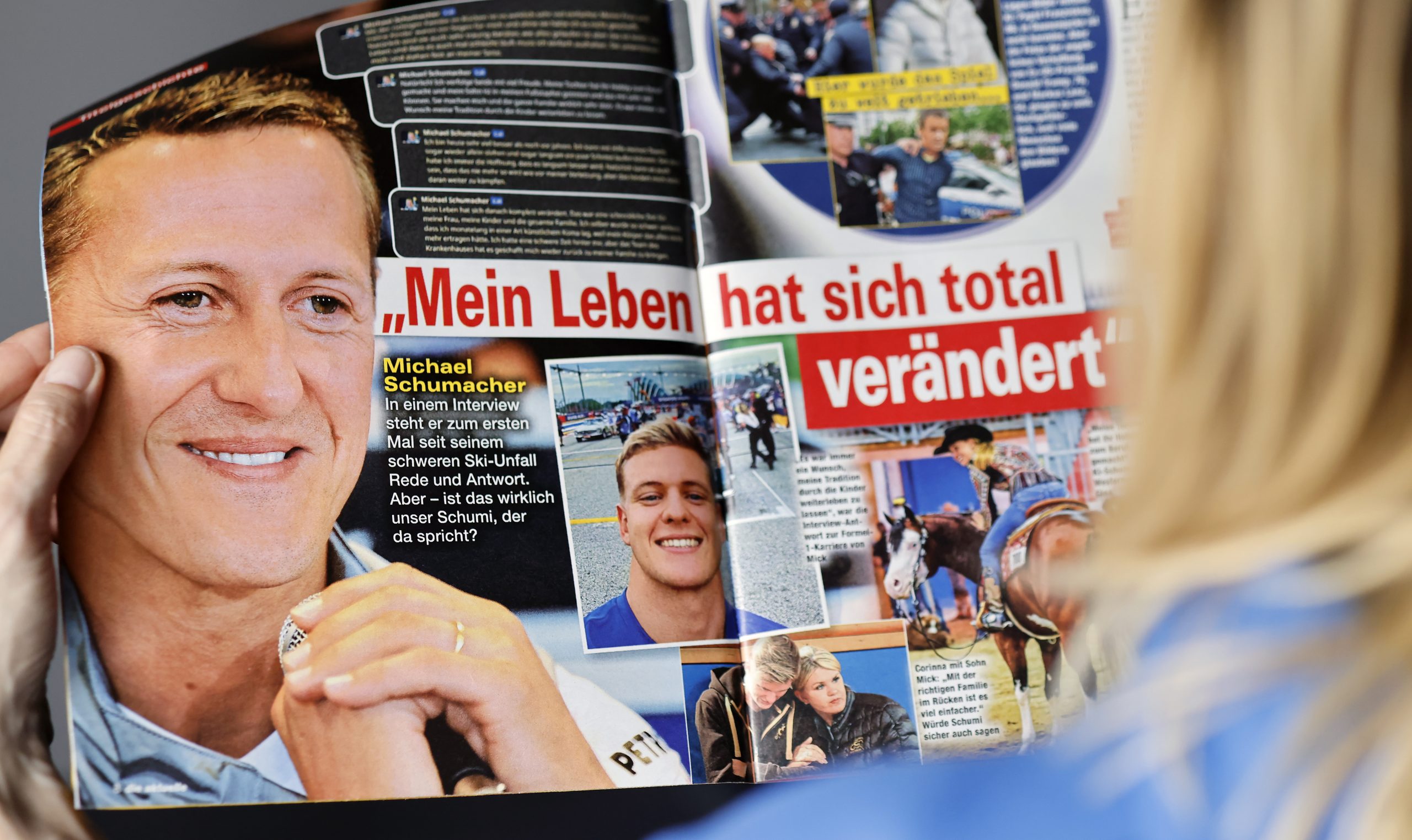 epa10581740 A woman reads the edition of German weekly magazine Die Aktuelle with the cover announcing a fake interview with Michael Schumacher, in Berlin, Germany, 20 April 2023. A spokesperson for the Schumacher family announced to take legal actions against the magazine that runs their cover with a story with a picture of Schumacher and under the headline "Michael Schumacher, the first interview" which was generated by an artificial intelligence (AI) chatbot. Formula One legend Schumacher retreated from public life following a skiing accident in the French Alps in 2013 and his family has remained protective of his privacy.  EPA/HANNIBAL HANSCHKE