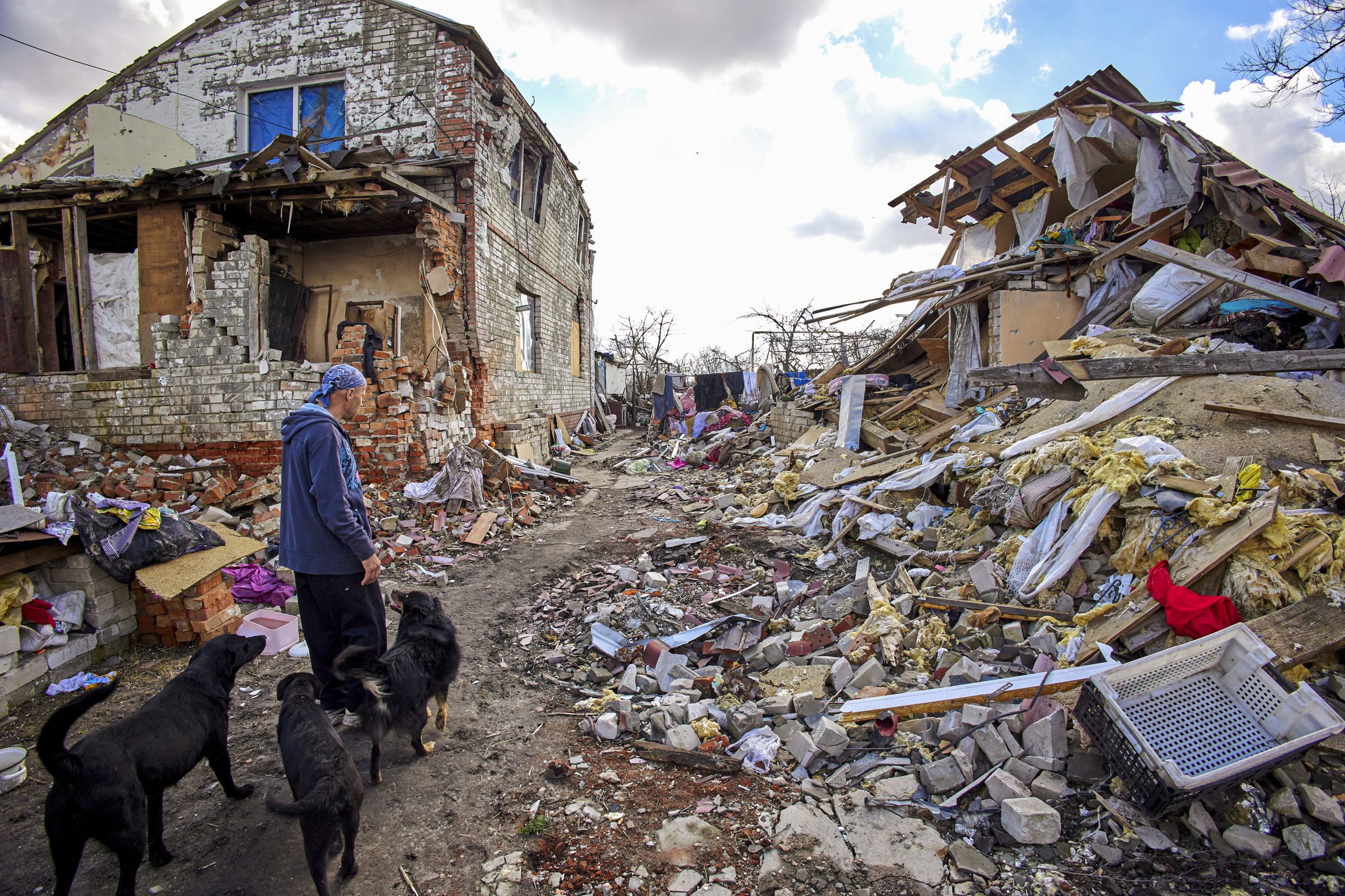 epa10545773 Local resident Gennady (49) shows the destroyed building of his neighbors in Cherkaski Tyshky, Kharkiv region, Ukraine, 27 March 2023. The Ukrainian army pushed Russian forces from occupied territory northeast of the country in counterattacks in the Autumn of 2022. Kharkiv and surrounding areas have been the target of heavy shelling since February 2022, when Russian troops entered Ukraine starting a conflict that has provoked destruction and a humanitarian crisis.  EPA/SERGEY KOZLOV