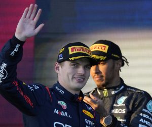 epa10555023 Dutch Formula One driver Max Verstappen (front) of Red Bull Racing reacts after winning the Formula One Grand Prix of Australia as second-placed British Formula One driver Lewis Hamilton (back) of Mercedes-AMG Petronas looks on at the Albert Park Circuit in Melbourne, Australia, 02 April 2023.  EPA/SIMON BAKER
