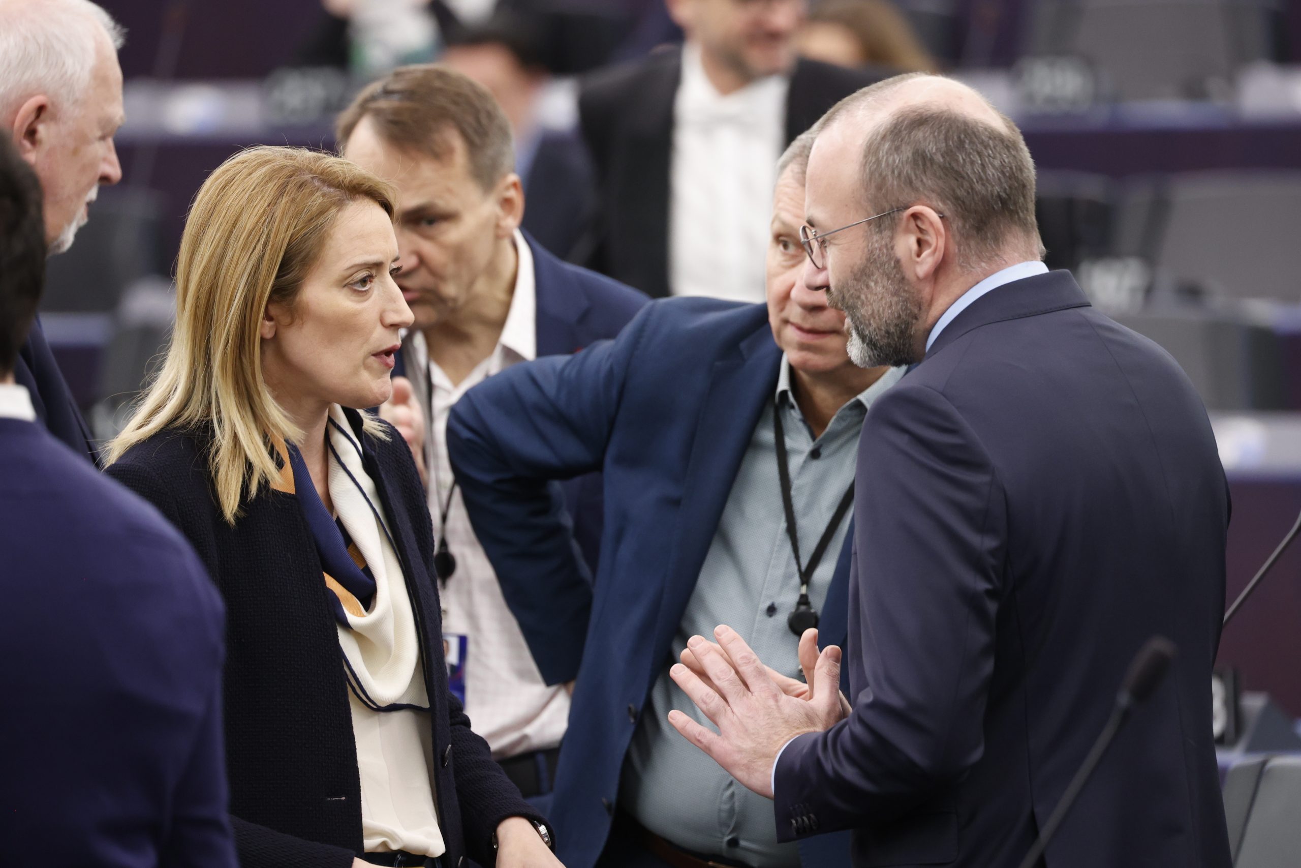 epa10577105 European Parliament President Roberta Metsola (L) speaks with President of the European People's Party (EPP) Manfred Weber (R), during the opening session of the European Parliament in Strasbourg, France, 17 April 2023. The session of the European Parliament runs from 17 till 20 April.  EPA/JULIEN WARNAND