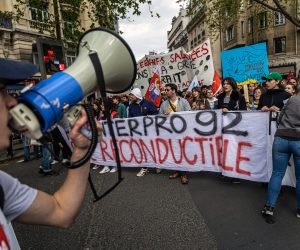 epa10582155 Demonstrators during a spontaneous march of workers and students against the pension reform to the headquarters of the French employers' organization 'Medef'  in Paris, France, 20 April 2023. France faces an ongoing national strike against the government's pensions reform after the prime minister on 16 March announced the use of article 49 paragraph 3 (49.3) of the Constitution of France to have the text on the controversial pension reform law to be definitively adopted without a vote.  EPA/CHRISTOPHE PETIT TESSON