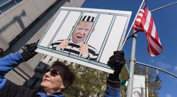 epa10590746 A person holding a sign outside of a federal court house on the first day of the sexual assault and defamation civil lawsuit brought by E. Jean Carroll against former President Donald Trump in New York, New York, USA, 25 April 2023. Carroll alleges that Trump raped her in the dressing room of New York department store in the 1990s.  EPA/JUSTIN LANE