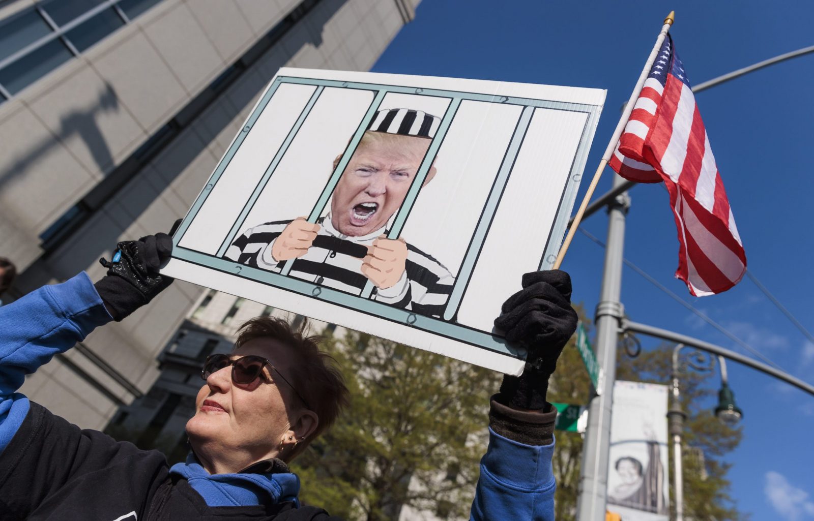 epa10590746 A person holding a sign outside of a federal court house on the first day of the sexual assault and defamation civil lawsuit brought by E. Jean Carroll against former President Donald Trump in New York, New York, USA, 25 April 2023. Carroll alleges that Trump raped her in the dressing room of New York department store in the 1990s.  EPA/JUSTIN LANE