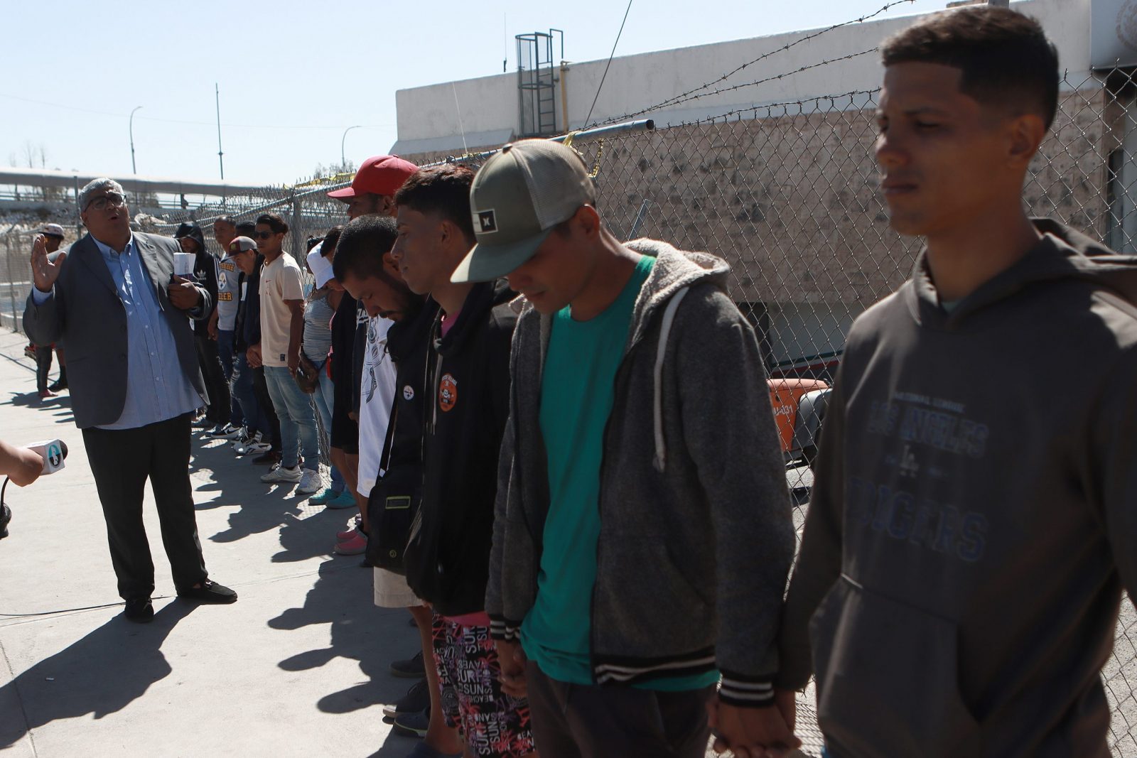 epa10595620 Migrants and relatives of those who died in the fire hold a vigil in memory of the 40 victims, in front of the National Institute of Migration (INM) in Ciudad Juarez, Mexico, 27 April 2023. One month after the fire, where 40 people died in a Mexican government immigration center in Ciudad Juarez, dozens of migrants held a vigil in prayer to the victims of this tragedy.  EPA/Luis Torres