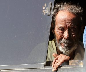 epa10600763 A man looks out a bus window as he arrives at Wadi Karkar bus station after fleeing Sudan in Aswan, southern Egypt, 30 April 2023. According to UNHCR thousands of people have fled Sudan since mid-April after heavily armed clashes between Sudan's military and rival paramilitary groups started in the capital Khartoum and other parts of the country on 15 April 2023.  EPA/KHALED ELFIQI
