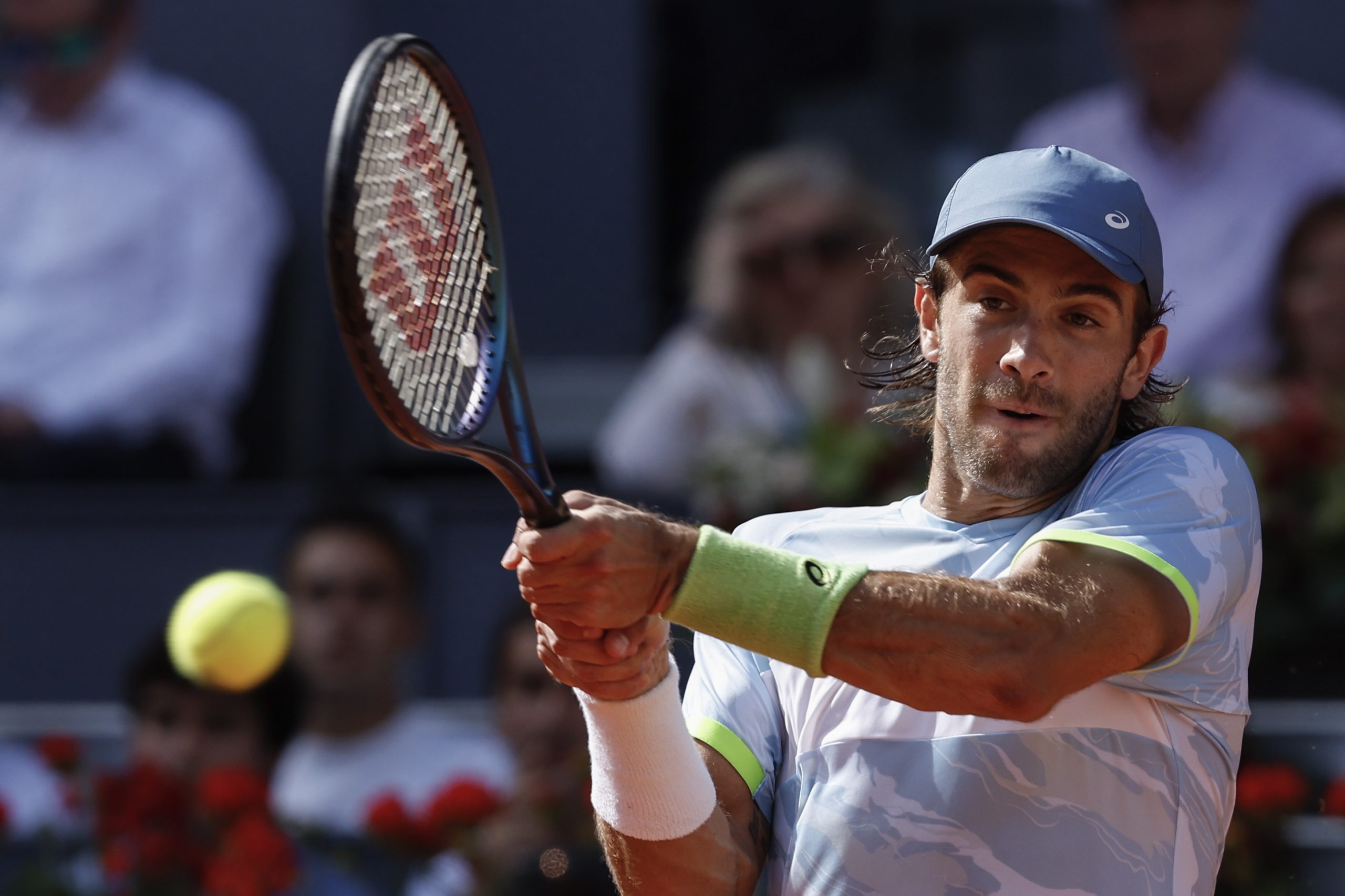epa10610673 Croatian tennis player Borna Coric in action against Spanish Carlos Alcaraz during their Mutua Madrid Open semi final tennis match held at the Magic Box, in Madrid, Spain, 05 May 2023.  EPA/Chema Moya
