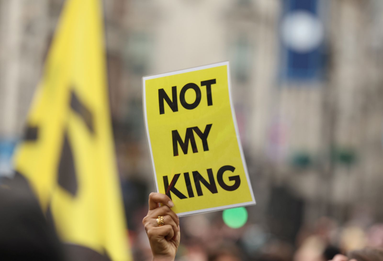 epa10611453 A person raises a placard as anti-monarchy group Republic protest on the day of the Coronation of Britain's King Charles III in London, Britain, 06 May 2023. The group wants to see the hereditary monarchy in Britain abolished and the King replaced by a democratically elected head of state.  EPA/Cathal McNaughton