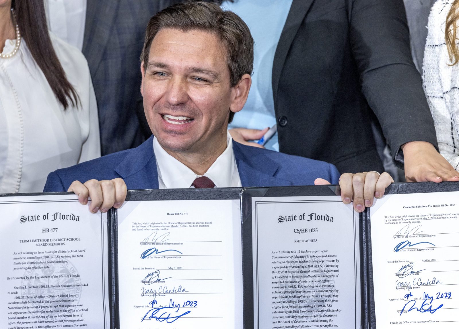 epa10617724 Florida Governor Ron DeSantis (C) show the documents after he signed the Teacher's Bill of Rights during an event at True North Classical Academy in Miami, Florida, USA, 09 May 2023. According to DeSantis Tweeter account, during the event he signed legislations to Protects teacher paychecks from automatic union deductions, to Creates a Teachers' Bill of Rights, to Reforms school board elections and to Removes social media from classrooms, in addition to approving a $1 billion for teacher salaries.  EPA/CRISTOBAL HERRERA-ULASHKEVICH