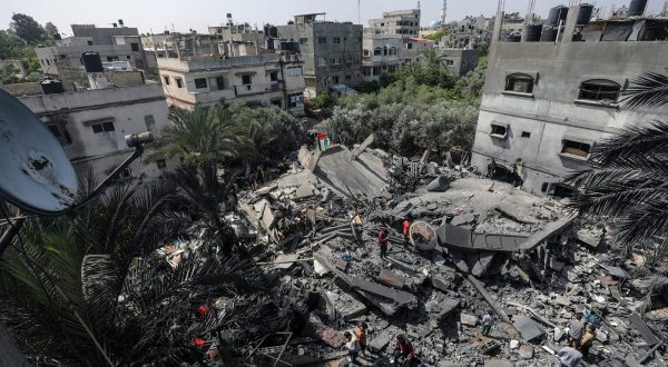 epa10620670 Palestinians inspect the rubble of a destroyed house of Islamic Jihad member Anas Al-Masri after Israeli air strikes late on 10 May in Beit Lahiya town, northern Gaza Strip, 11 May 2023. Palestinian militants in Gaza have fired rockets towards Israel, after the Israeli military carried out a series of air strikes on Islamic Jihad rocket launchers.  EPA/MOHAMMED SABER