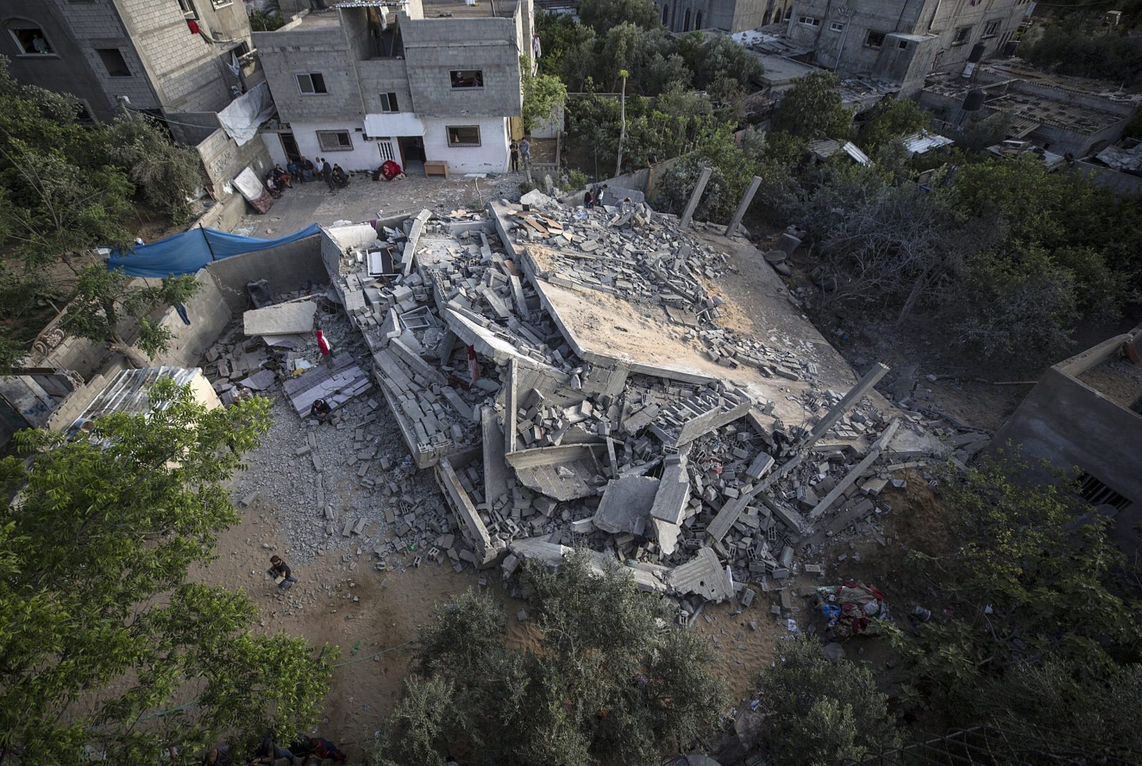 epa10625716 The destroyed house of the Nabhan family following an Israeli air strike in Beit Lahiya town in northern Gaza Strip, 13 May 2023. Ten members of the Nbhan family are disabled. Israel carried out several attacks against the military leadership of the Islamic Jihad movement in the Gaza Strip since 09 May 2023. Fighting continues between Israel and the militants of the Al-Quds Brigades, the armed wing of the Palestinian Islamic Jihad, in Gaza Strip.  EPA/HAITHAM IMAD