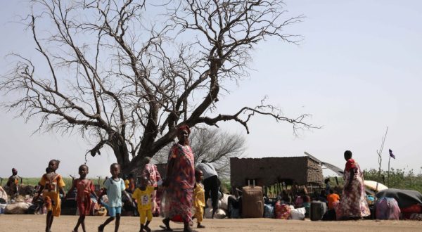 epa10628534 South Sudanese returnees who fled the ongoing conflict in Sudan, gather in the vicinity of the fluvial port of Renk as they wait to be transported south, in the Upper Nile State town of Renk, South Sudan, 14 May 2023. According to Mohajer Mhadi Khalifa, head of the boats union in charge of regulating the transport on the Nile in Renk, five boats are planned to transport the returnees to their areas of origin on the Nile towards the Southern Town of Malakal and other locations. On 14 May 2023 a group of 348 people embarked for the trip, following 577 others who made the same trip the previous day after days of waiting in the fluvial port of Renk. The transport was coordinated and organized by the IOM, Caritas and the RCC (the South Sudanese Relief and Rehabilitation Commission). According to the United Nations, some 200,000 people have fled the conflict in Sudan between 15 April and 12 May 2023. Most of them left towards neighboring countries such as Egypt, Tchad, South Sudan or Ethiopia, and about two million people were internally displaced. Leaving behind them the armed conflict between the Sudanese military and the RSF (Rapid Support Forces) militia, most of the refugees in South Sudan are South Sudanese returnees, part of the some 800,000 who had previously fled the war in South Sudan and who are now returning to a country which is barely out of conflict itself with tensions still remaining in many areas.  EPA/AMEL PAIN