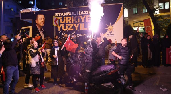 epa10628705 Supporters of Turkish President Recep Tayyip Erdogan react after early election results were announced in Istanbul, Turkey, 14 May 2023, as the country holds simultaneous parliamentary and presidential elections.  EPA/TOLGA BOZOGLU