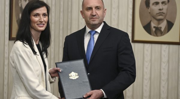epa10629343 Bulgarian President Rumen Radev (R) and European Commissioner for Innovation, Research, Culture, Education and Youth Mariya Gabriel, Bulgaria's GERB-SDS party's candidate for prime minister, pose for photographers during an official ceremony of handing the mandate to form a new government in Sofia, Bulgaria, 15 May 2023. Talks about forming a government have been ongoing since Bulgaria's early parliamentary elections on 02 April.  EPA/VASSIL DONEV