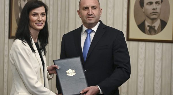 epa10629343 Bulgarian President Rumen Radev (R) and European Commissioner for Innovation, Research, Culture, Education and Youth Mariya Gabriel, Bulgaria's GERB-SDS party's candidate for prime minister, pose for photographers during an official ceremony of handing the mandate to form a new government in Sofia, Bulgaria, 15 May 2023. Talks about forming a government have been ongoing since Bulgaria's early parliamentary elections on 02 April.  EPA/VASSIL DONEV