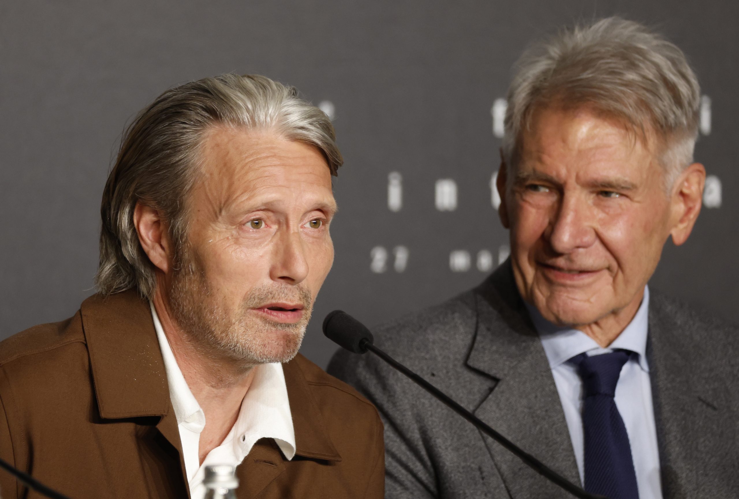 epa10638673 Actors Mads Mikkelsen (L) and Harrison Ford attends the press conference for 'Indiana Jones And The Dial Of Destiny' during the 76th annual Cannes Film Festival, in Cannes, France, 19 May 2023. The movie is presented out of the competition of the festival which runs from 16 to 27 May.  EPA/SEBASTIEN NOGIER / POOL