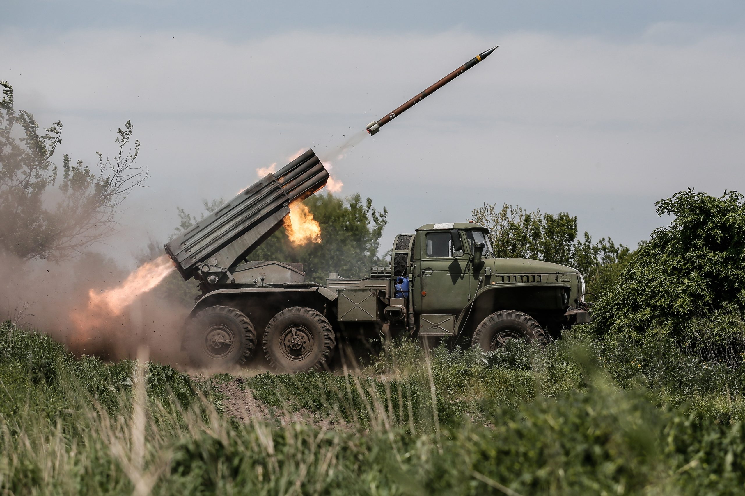 epa10638729 Ukrainian servicemen from the 24th Mechanized Brigade 'King Danylo' fire a BM-21 'Grad' multiple rocket launcher system (MLRS) in the direction of the frontline city of Bakhmut, at an undisclosed location, Donetsk region, eastern Ukraine, 19 May 2023, amid the Russian invasion. The frontline city of Bakhmut, a key target for Russian forces, has seen heavy fighting for months. Russian troops on 24 February 2022, entered Ukrainian territory, starting a conflict that has provoked destruction and a humanitarian crisis.  EPA/OLEG PETRASYUK