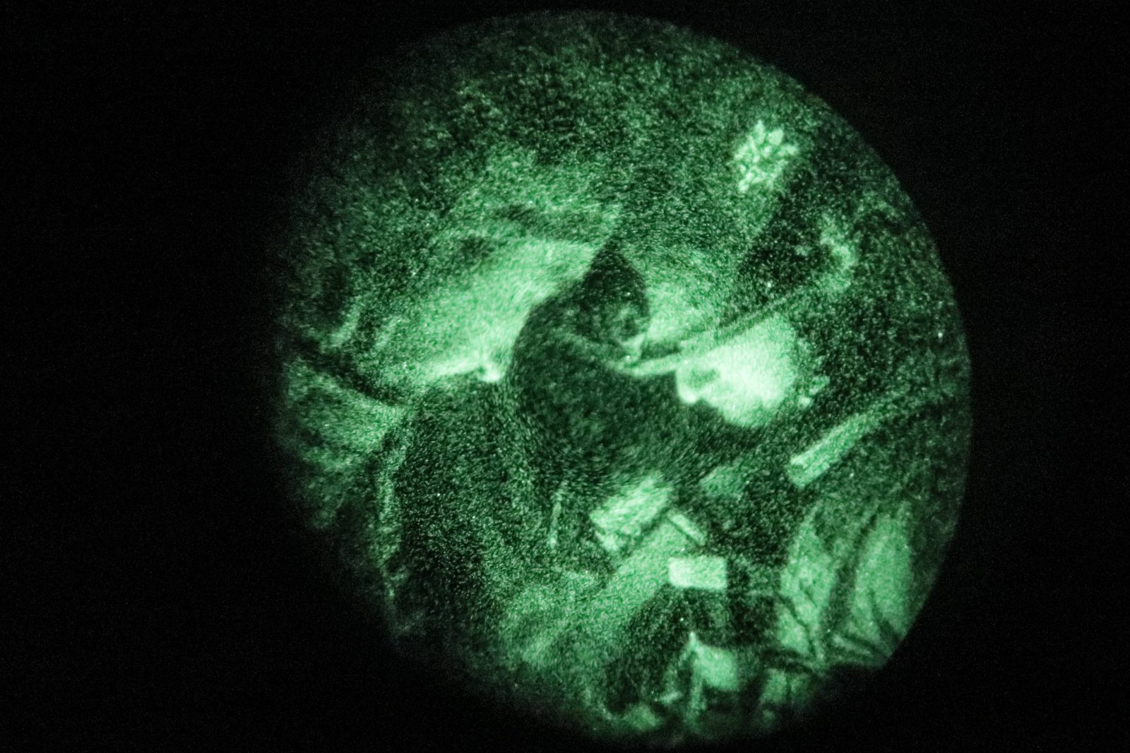 epa10639941 A picture taken through a night-vision device of Ukrainian servicemen from the 24th Mechanized Brigade 'King Danylo' at an undisclosed location in the Donetsk region, eastern Ukraine, 19 May 2023 (issued 20 May 2023), amid Russia's invasion. Russian troops entered Ukraine on 24 February 2022 starting a conflict that has provoked destruction and a humanitarian crisis.  EPA/OLEG PETRASYUK