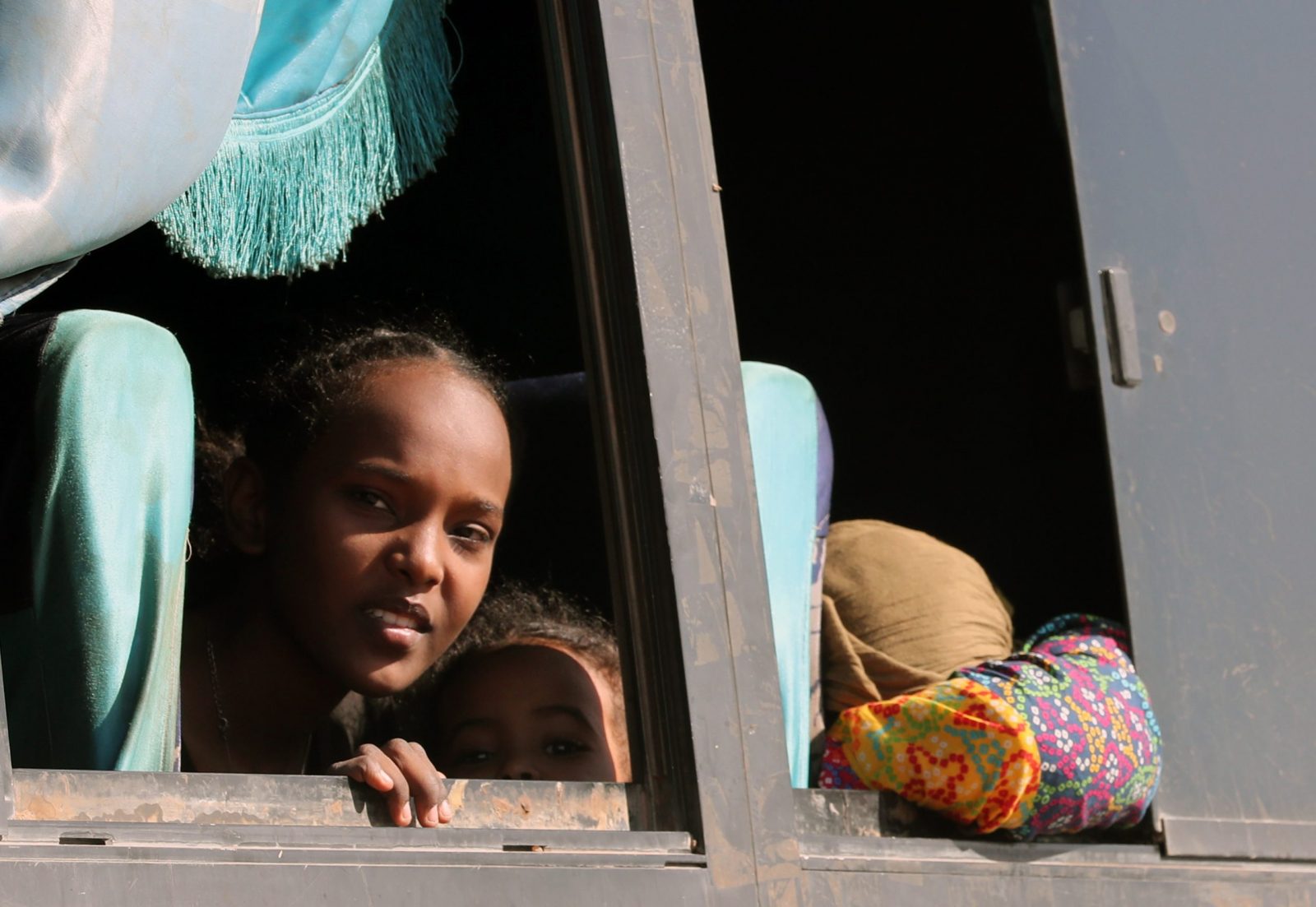 epa10639982 Buses carrying Sudanese people traverse the Nile River on a ferry after crossing the border from Sudan, in Abu Simbel, southern Egypt, 20 May 2023. According to the UNHCR office, more than 100,000 Sudanese have crossed into Egypt since the beginning of an armed conflict on 15 April between the Sudanese military and the RSF (Rapid Support Forces) militia. The UN estimates some 200,000 people have fled Sudan since the conflict erupted.  EPA/KHALED ELFIQI